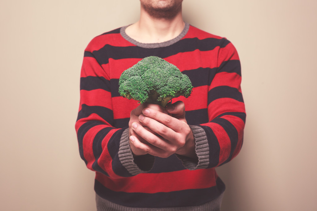 Man holding broccoli