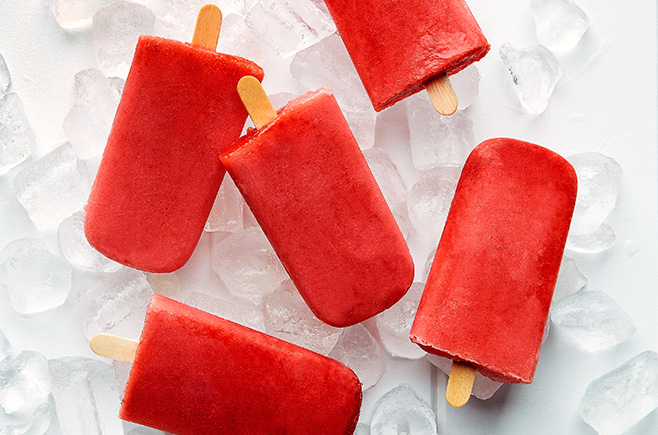 Colourful strawberry and coconut popsicles made from only four ingredients.