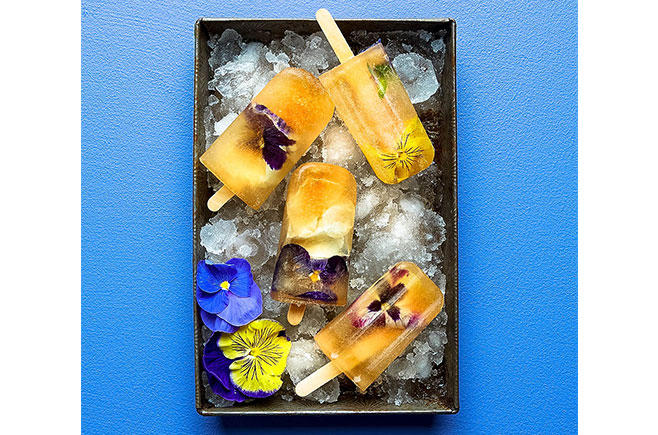 Iced tea popsicles with edible flowers