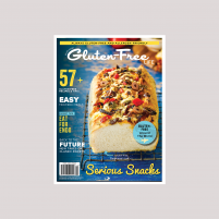 Issue 34 cover of Australian Gluten-Free Life magazine featuring loaf of gluten-free bread with ploughmans topping on a blue board.