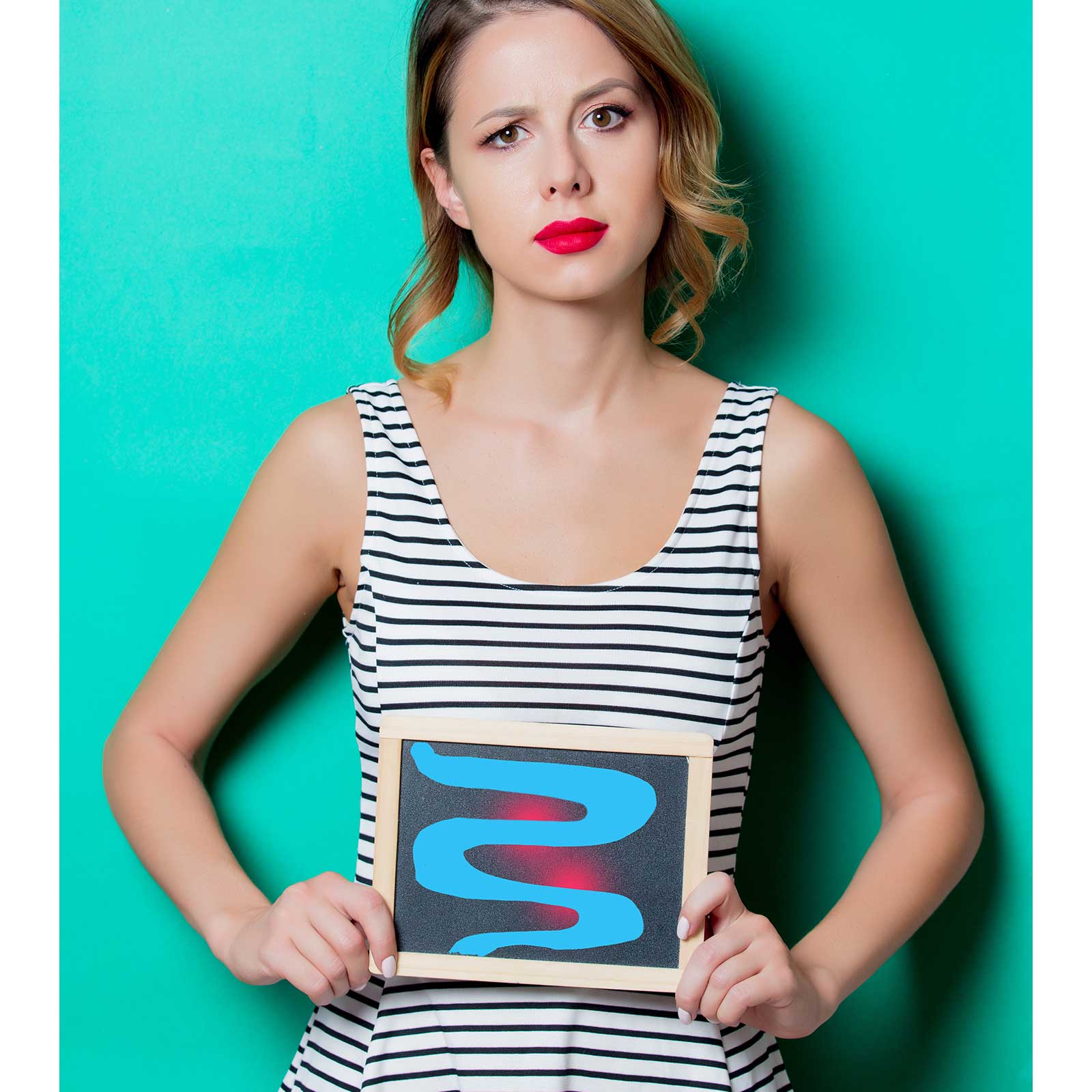 Woman in a black and white striped singlet stands in front of a teal background holding an image of an inflamed intestine.
